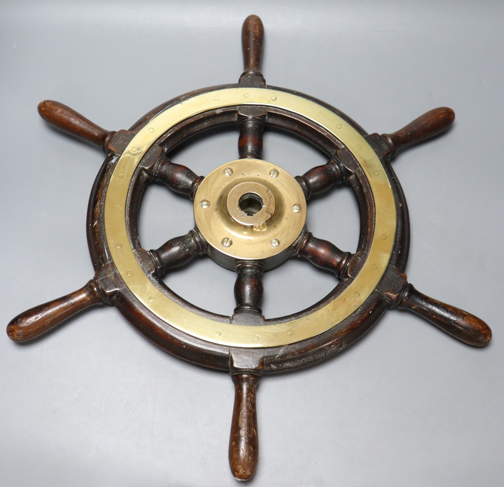 A small 19th century brass and hardwood ships wheel, width 56cm